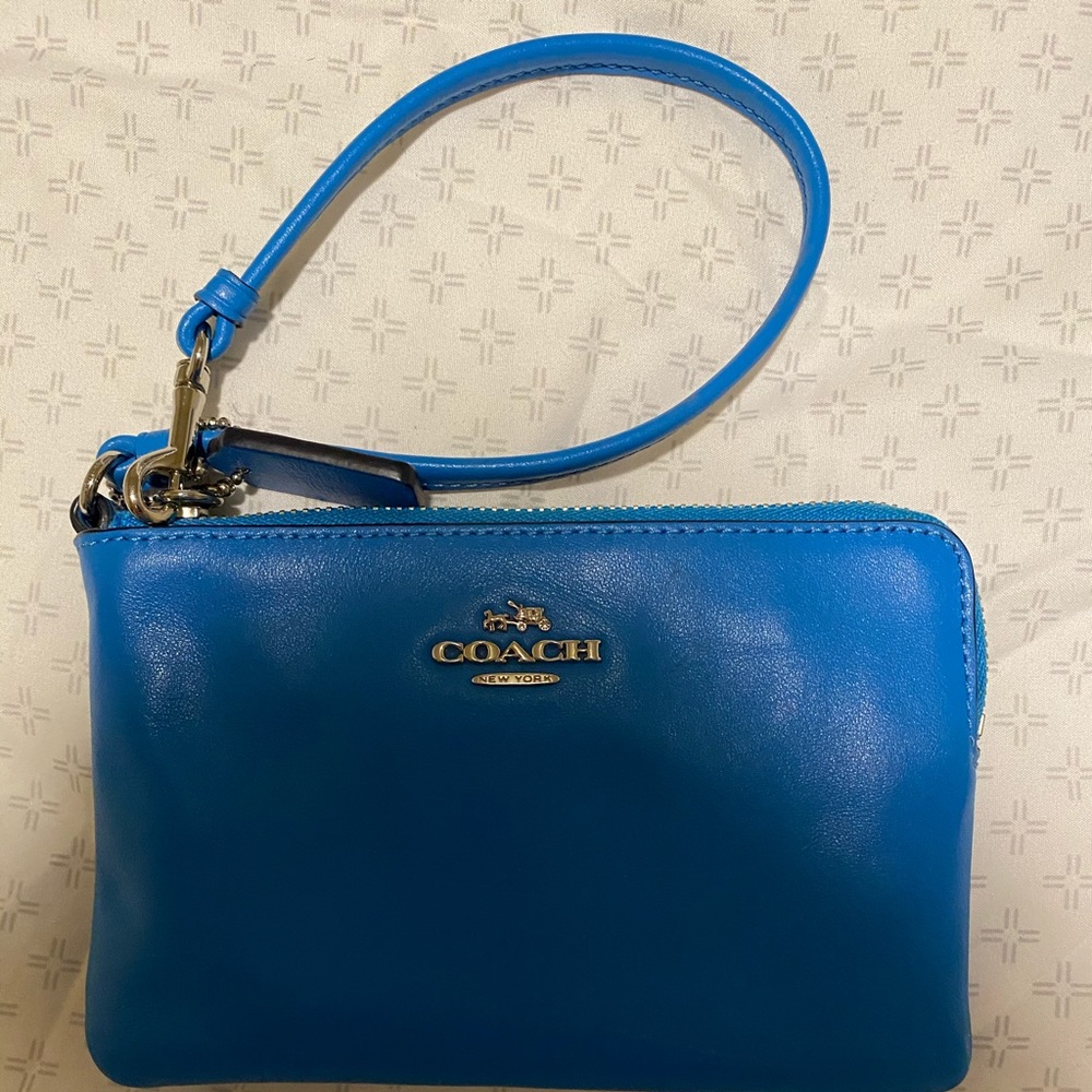 Bright blue coach wristlet